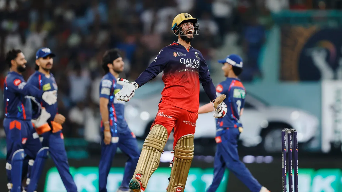 Cricket bowler delivering fast ball during IPL game